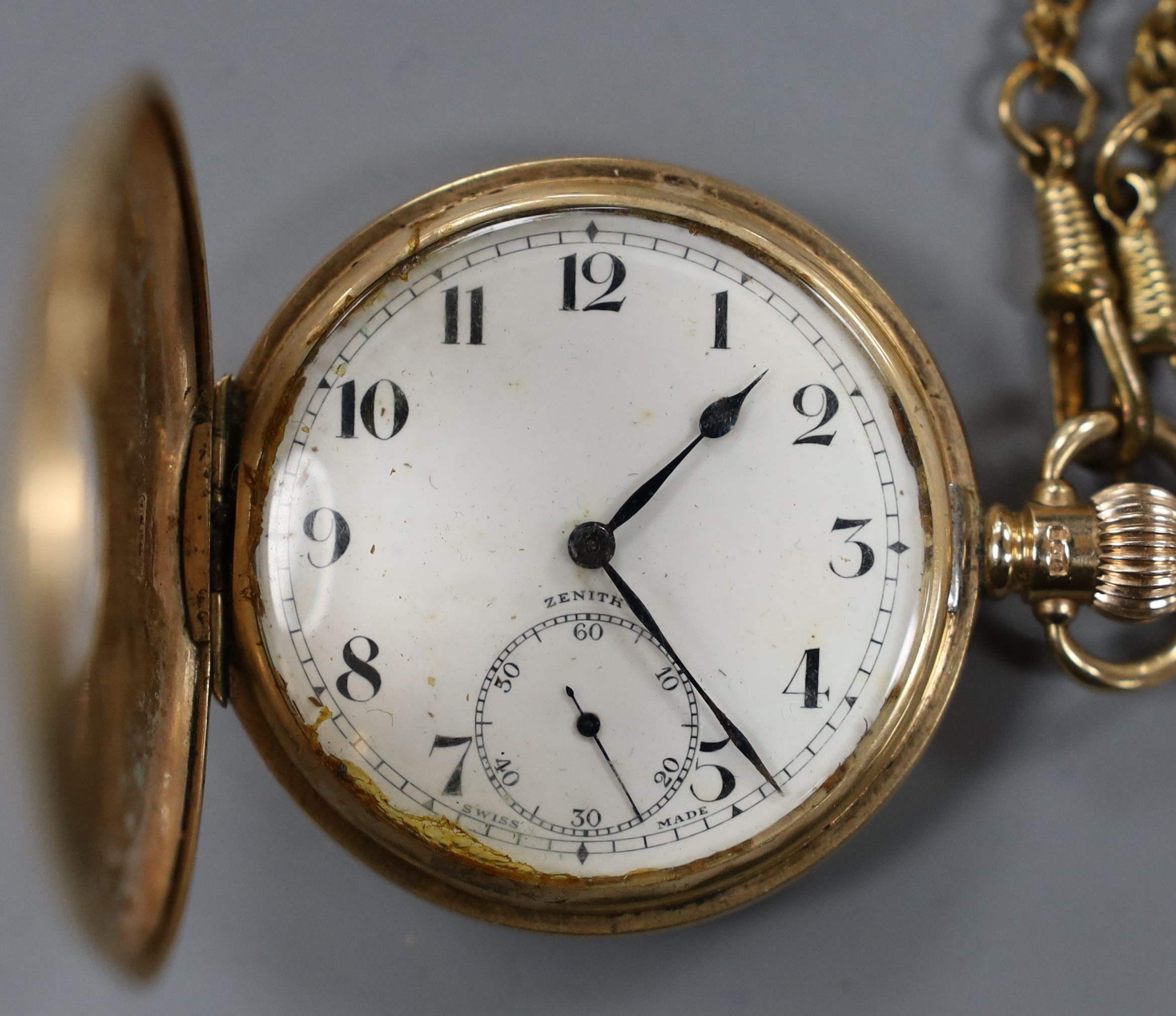 A George V 9ct gold half hunter keyless Zenith pocket watch, case diameter 50mm, gross 99 grams, with a gilt metal albert.